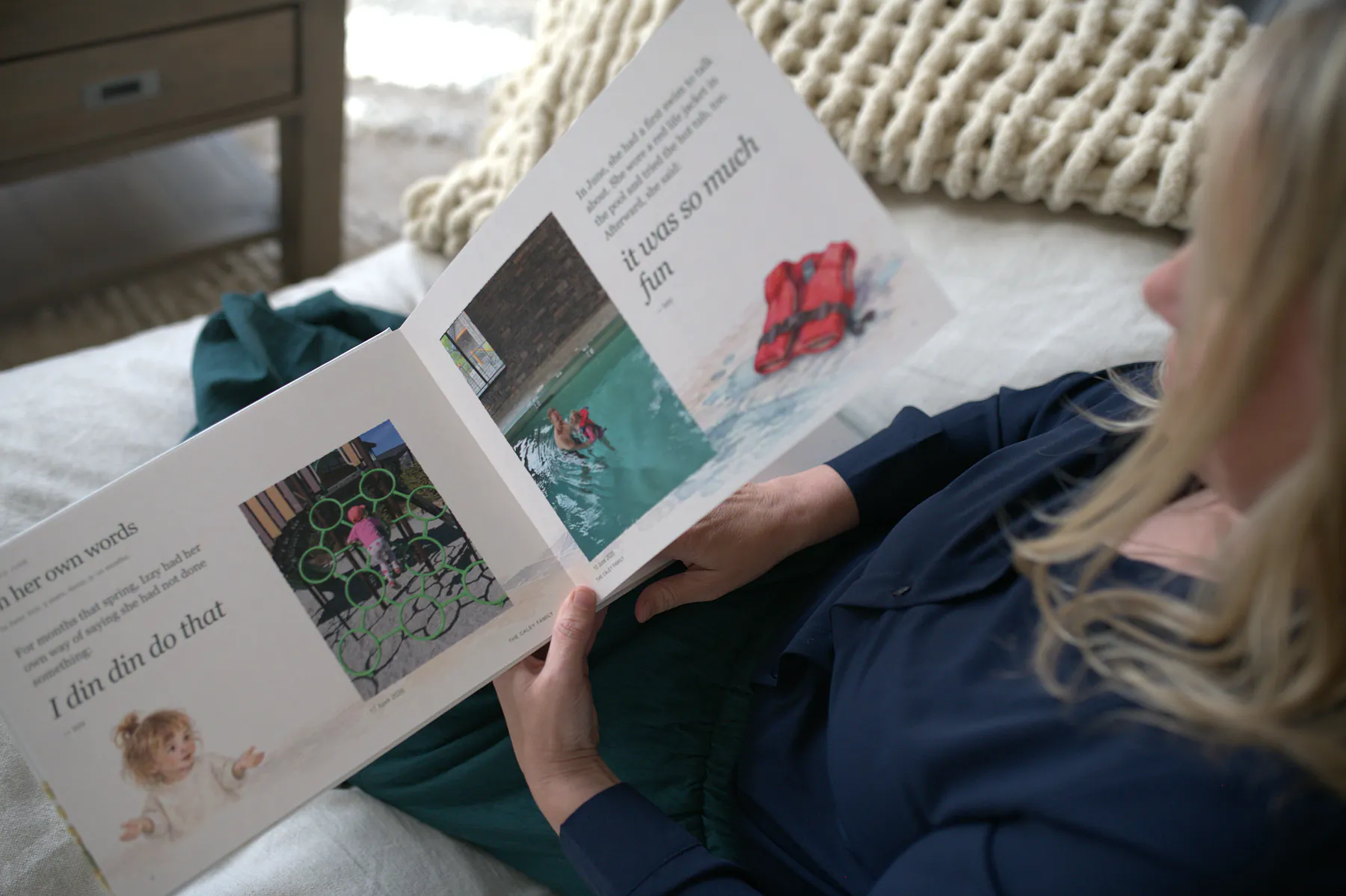 Nicole’s book open on her lap to a June spread: Izzy’s words, I din din do that, and it was so much fun, beside her photos.