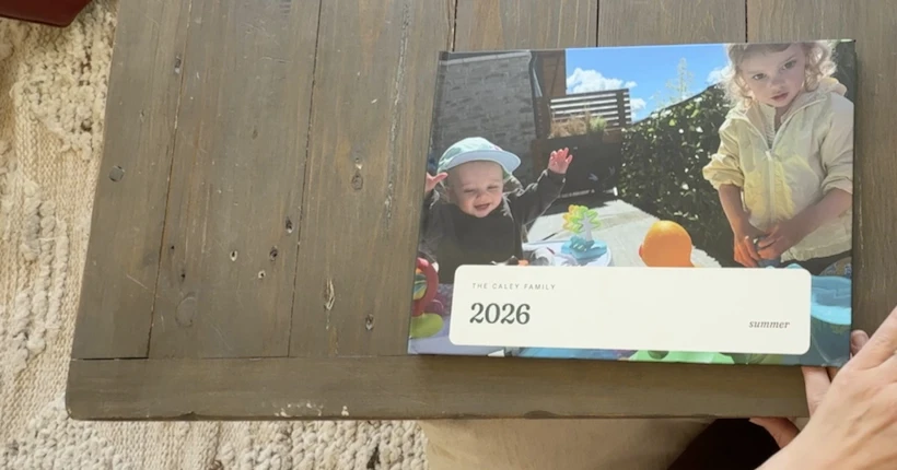 A real Tuck family book held in a parent&rsquo;s hands.